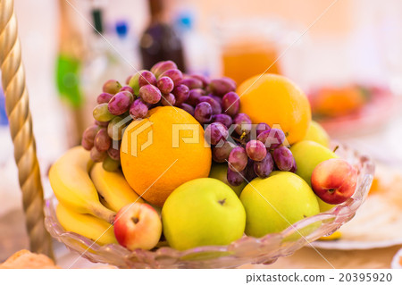 full glass vase of ripe tasty fruit full glass vase of ripe tasty fruit 20395920