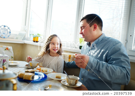 family has breakfast in the morning 20397539