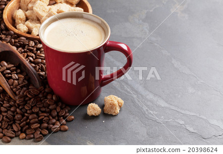 Coffee cup, beans and brown sugar Coffee cup, beans and brown sugar 20398624