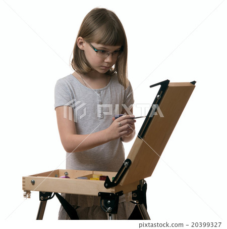 The girl draws a painting at the easel on white The girl draws a painting at the easel on white 20399327