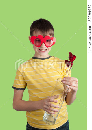 Cute boy in red glasses with hearts and vase Cute boy in red glasses with hearts and vase 20399622