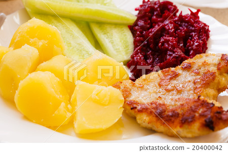 Dinner meal. Fried chicken potatos salad on plate. Dinner meal. Fried chicken potatos salad on plate. 20400042