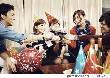 Men and women enjoying home parties Men and women enjoying home parties 20403243