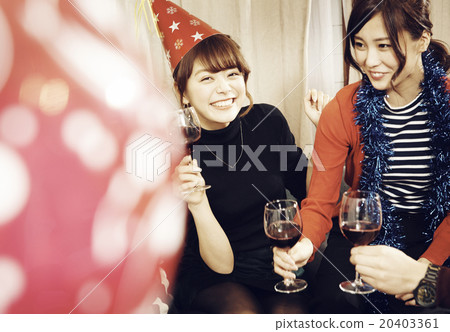 Men and women enjoying home parties Men and women enjoying home parties 20403361