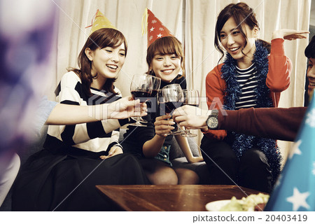 Men and women enjoying home parties Men and women enjoying home parties 20403419