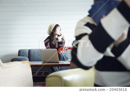 A woman drinking coffee 20403618