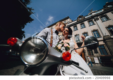 bride and groom on vintage motor scooter bride and groom on vintage motor scooter 20409998