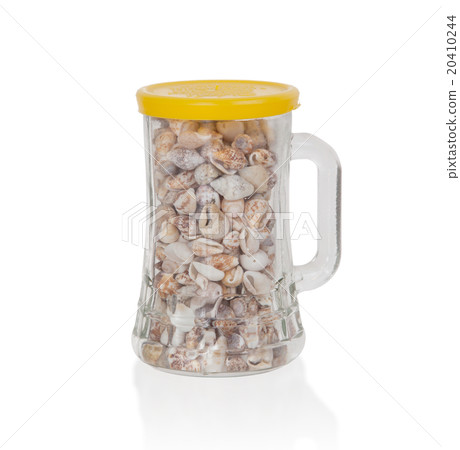Old jar filled with small seashells Old jar filled with small seashells 20410244