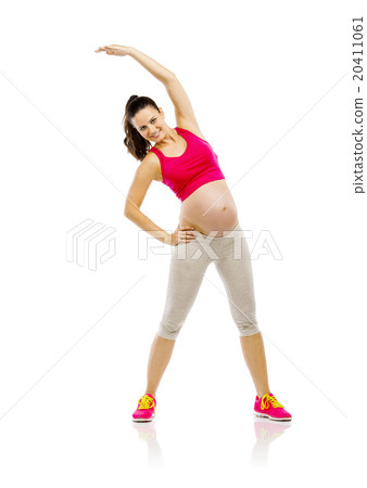 Pregnant fitness woman isolated on white 20411061