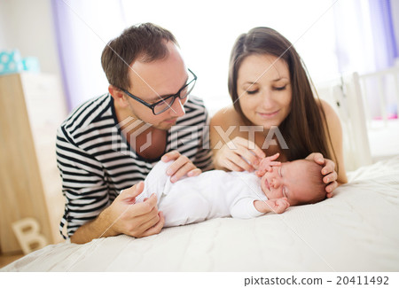 Parents with newborn baby at home Parents with newborn baby at home 20411492