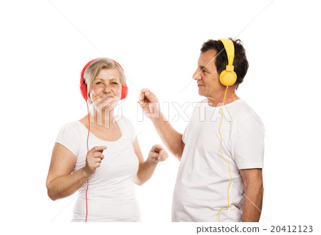 Senior couple with headphones 20412123