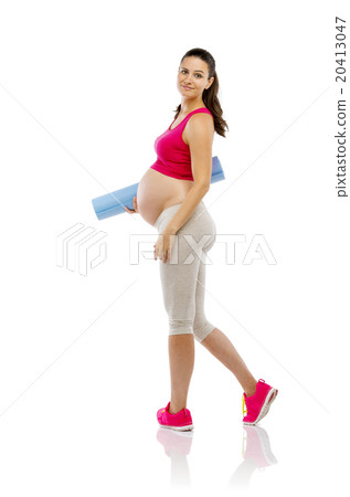 Pregnant fitness woman isolated on white 20413047