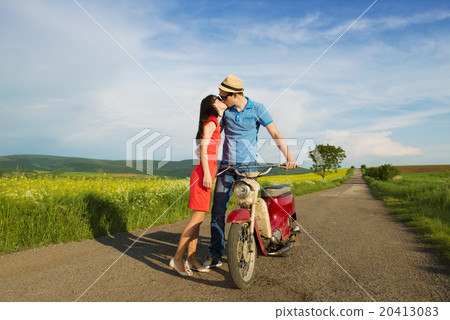 Couple on motorbike Couple on motorbike 20413083