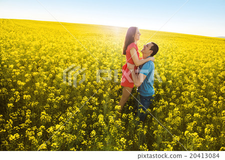 Couple in love in field Couple in love in field 20413084
