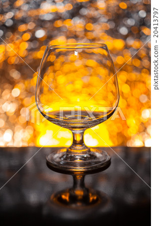 Whiskey glass empty on the background bokeh Whiskey glass empty on the background bokeh 20413797