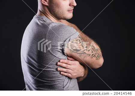 Man with tattoo 20414546