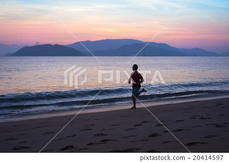 Man running on the beach 20414597