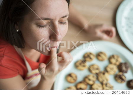 Woman is making christmas cakes Woman is making christmas cakes 20414633