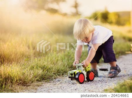 Little boy playing outside 20414661