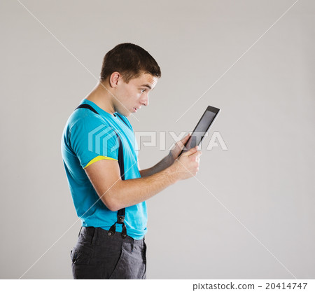 Young man with tablet 20414747
