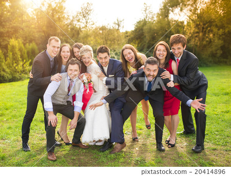 Newlyweds with guest posing in park Newlyweds with guest posing in park 20414896