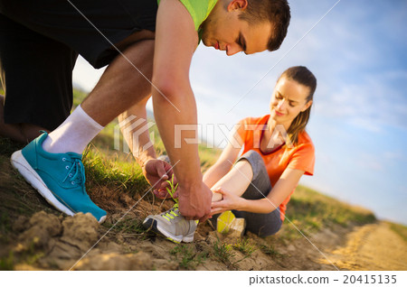 Female runner with twisted ankle Female runner with twisted ankle 20415135