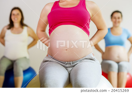 Pregnant women exercising 20415269
