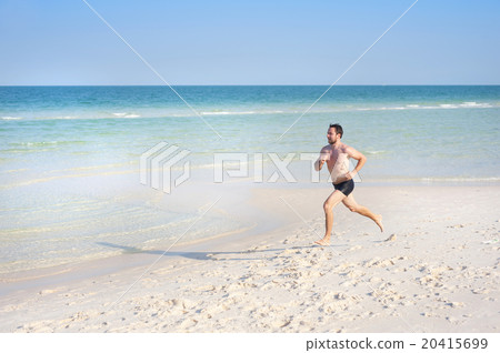 Man running on the beach 20415699