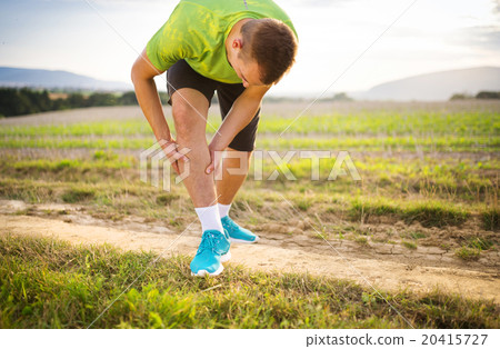 Runner with injured calf Runner with injured calf 20415727
