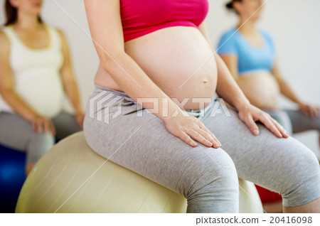 Pregnant women exercising 20416098