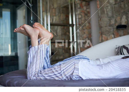 couple relax and have fun in bed 20418835