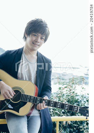 Man playing guitar Man playing guitar 20419784