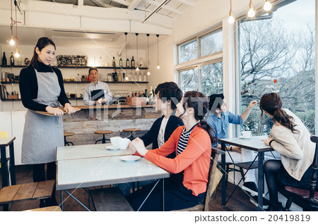 People relaxing at the cafe 20419819