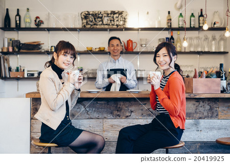 A couple drinking coffee A couple drinking coffee 20419925