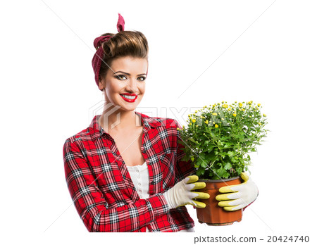 Woman with pin-up hairstyle holding flower pot 20424740