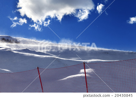 Off-piste slope during a blizzard and sunlight sky 20430845