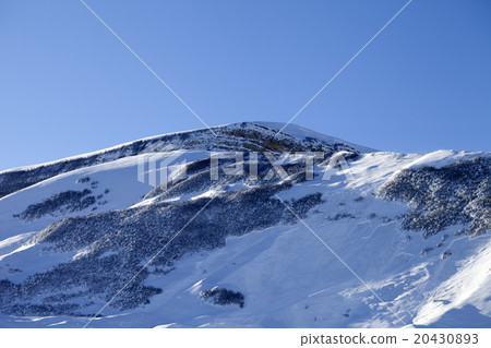 Snowy mountains with track from avalanche  20430893