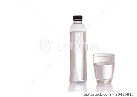Drinking water in bottles and glasses on a white b Drinking water in bottles and glasses on a white b 20430915