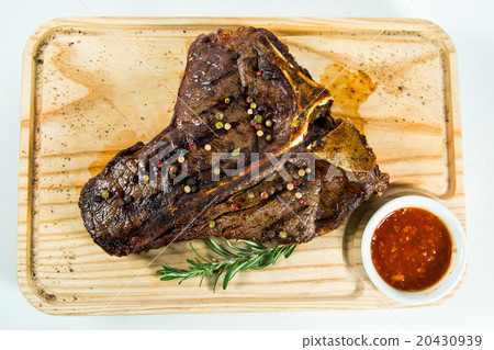 Beautiful juicy well done steak with sauce 20430939