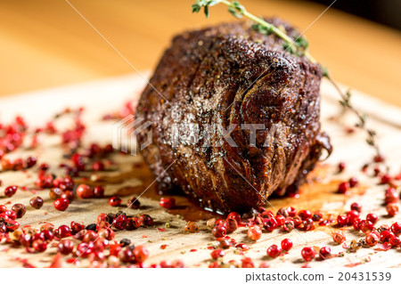 juicy well done a piece of meat with sauce  20431539