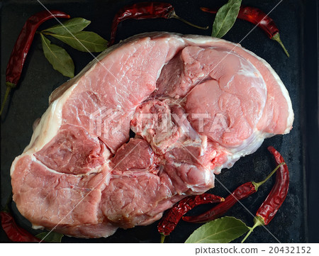 raw meat on a black background with spices 20432152