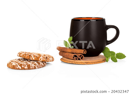 Black tea cup with cinnamon and cookies on white Black tea cup with cinnamon and cookies on white 20432347