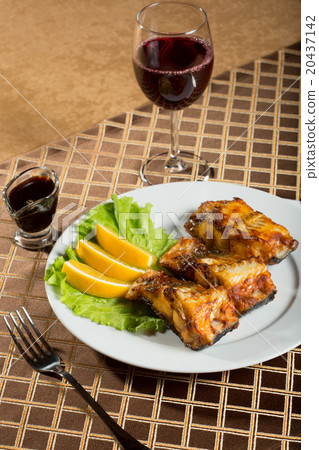 fried catfish. delicious fatty fish on a plate 20437142