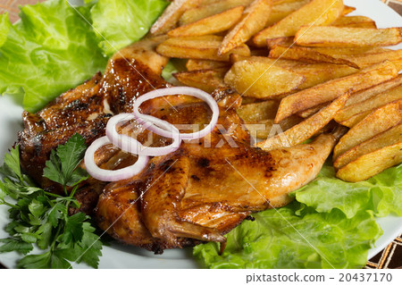 Tobacco chickens with fried potatoes.  20437170