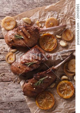 Delicious beef steak with rosemary on a paper Delicious beef steak with rosemary on a paper 20438901