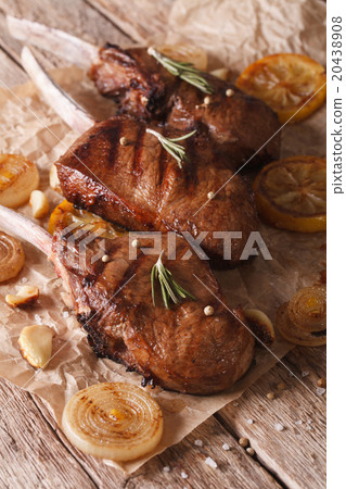 Rustic beef steak with lemon on the paper Rustic beef steak with lemon on the paper 20438908