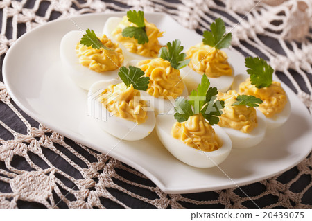 Delicious stuffed eggs close-up on a plate Delicious stuffed eggs close-up on a plate 20439075