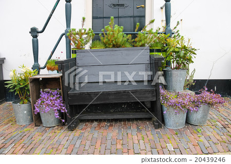 Traditional Dutch wooden bench surrounded  20439246