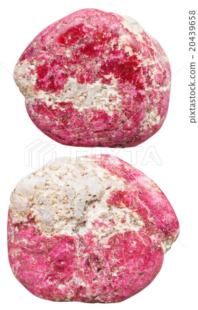two tumbled Thulite (rosaline) gemstones isolated 20439658