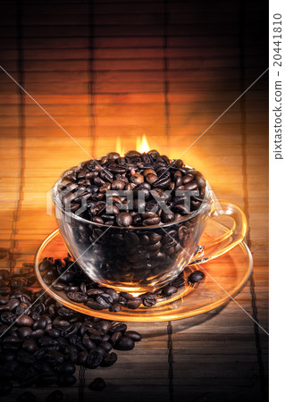 Steaming cup of coffee on fire 20441810